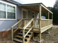 a small house with steps leading up to it