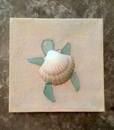 a sea turtle is depicted on a tile