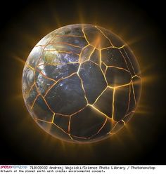 an image of a cracked earth with the sun shining down on it's surface