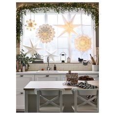 the kitchen is decorated for christmas with star decorations