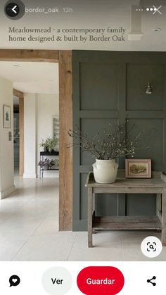 an image of a living room with grey walls and white tile flooring, including a table