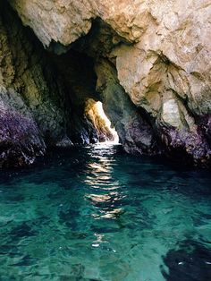 the water is clear and blue in this cave