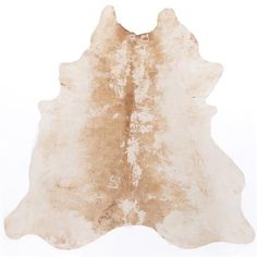 a brown and white cowhide rug on a white background