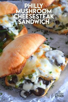 there are two sandwiches with cheese and mushrooms on them