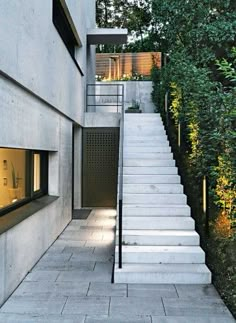 stairs leading up to a house with trees in the background