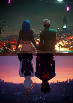 two people sitting on top of a roof looking at the city lights in the distance