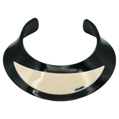 CHANEL by KARL LAGERFELD rigid black and off-white resin choker necklace embossed CHANEL. From the Fall 2007 CHANEL Collection. Embossed CHANEL 07 A Made in Italy. Indicative measurements : inner circumference approx. 33.93 cm (13.36 inches) / max. width approx. 4.5 cm (1.77 inches) / neck opening aprox. 7.6 cm (2.99 inches). Material : Resin. NOTES - This is a preloved vintage item, therefore it might have imperfections. - Colors may differ slightly from actual product appearance due to differe Chanel Vintage, Chanel Collection, Karl Lagerfeld, Christian Dior, Choker Necklace, Dior, Off White, Vintage Items, Chanel