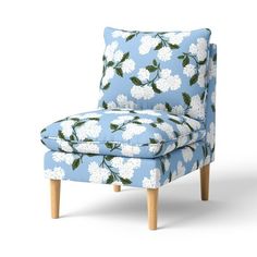 a blue chair with white flowers on it