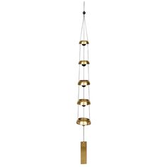 a metal and brass wind chime with five bells hanging from it's sides