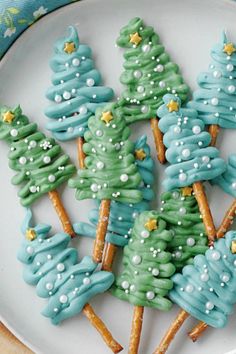 a plate with cookies decorated like christmas trees