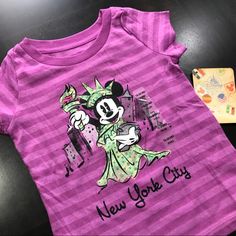 Disney Minnie Baby Girl New York City Short Sleeves T-Shirt New With Tag Disney Store 60%Cotton, 40% Polyester From A Pet Free And Smoke Free Environment Disney Minnie Mouse Pink T-shirt, Pink Disney Cotton T-shirt, Cute Pink Minnie Mouse T-shirt, Fun Pink Minnie Mouse Top, Pink Cotton Minnie Mouse Tops, Disney Pink Minnie Mouse T-shirt, Pink Mickey Mouse Cotton T-shirt, Pink Cotton Mickey Mouse T-shirt, Pink Minnie Mouse Crew Neck T-shirt