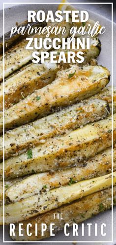 roasted parmesan garlic zucchini spears on a plate with the recipe title