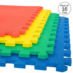 four different colored mats stacked on top of each other