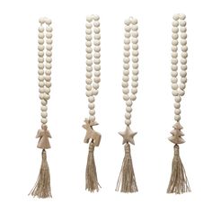 three wooden beads with tassels hanging from the ends and two stars on each bead