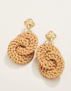 A woven cane pattern stud of 18kt matte gold plating tops lightweight woven wicker rings to create a one-of-a-kind look in our Cane Wicker Ring Earrings. Elegant Gold Woven Earrings, Handwoven Gold Jewelry For Summer, Elegant Woven Drop Earrings, Summer Gold Woven Jewelry, Handwoven Gold Earrings For Summer, Elegant Woven Jewelry For Summer, Chic Woven Jewelry For Vacation, Elegant Woven Earrings For Vacation, Woven Natural Jewelry For Vacation