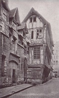 an old black and white photo of some buildings