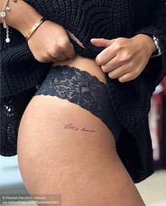 a woman with a tattoo on her thigh