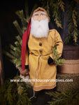 a statue of santa claus is standing in front of a potted plant