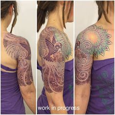 the woman is wearing a purple dress and has tattoos on her arm, shoulder and chest