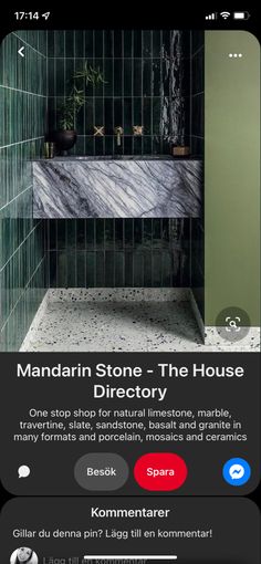 an iphone screenshot shows the interior of a bathroom with green tile and black walls