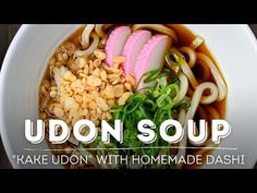 udon soup made with homemade dashi noodles and meats in a white bowl