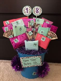 a bucket filled with lots of money sitting on top of a carpet