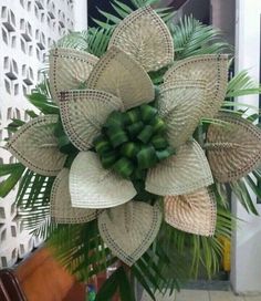 a bunch of green and white flowers in a vase