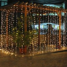 an outdoor gazebo covered in white lights