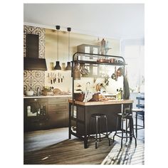 a kitchen with lots of counter space and stools next to an island in the middle