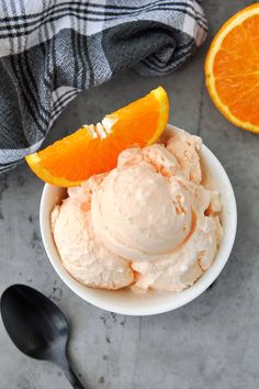 an orange ice cream in a white bowl