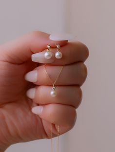 Tiny Diamond & Pearl earrings✨ fresh water pearl and natural diamond setting dangle earrings. 14K solid gold jewelry. * Detail * Material : 14k solid gold with fresh water pearl and genuine diamond. color : rose gold, gold or white gold * Size * Earring length : 10~11mm Diamond: Genuine 2mm brilliant cut diamond / VS Clarity / H color. Pearl : 4.5~5mm fresh water pearl. *We provide special package with some our business card, guarantee card, gift box. please check our shop policies and we lo Diamond Pearl Earrings, Small Pearl Earrings, Pearl And Diamond Necklace, Freshwater Pearl Jewelry