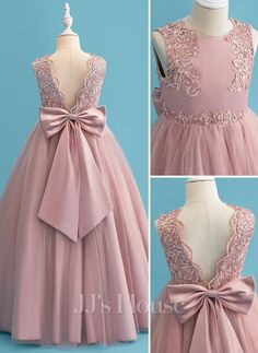 the dress is pink and has a bow on it