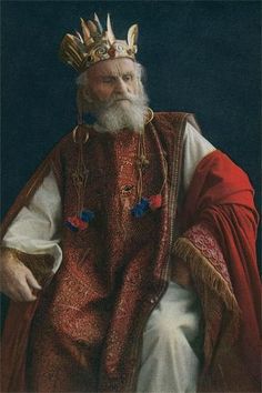 an old man with a beard wearing a crown