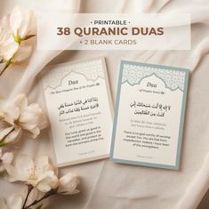 two cards with arabic writing on them next to flowers and a white sheet that says, printable islamic duas 2 blank cards