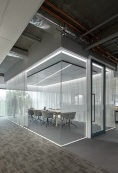 an empty conference room with glass walls