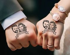 two people holding hands with tattoos on them