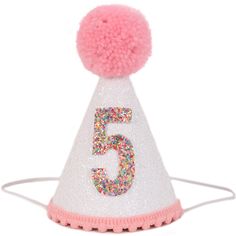 a pink and white birthday hat with the number five on it's side, decorated with multicolored sprinkles