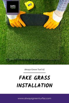 the fake grass installation is being installed in front of someone's feet and hands