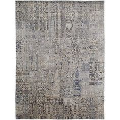 an area rug with many different colors and patterns on the carpet, including grays