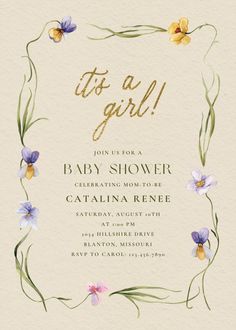 the baby shower is decorated with flowers and greenery in gold, purple, and green