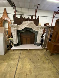 an old fireplace is being worked on in a shop