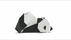 a black and white origami panda bear