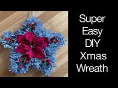 an ornament made out of yarn and poinsettis with the words super easy diy xmas wreath