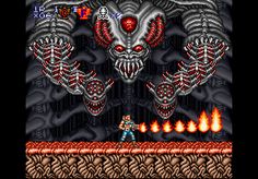 an old - school video game with a demonic face and demon head on the screen