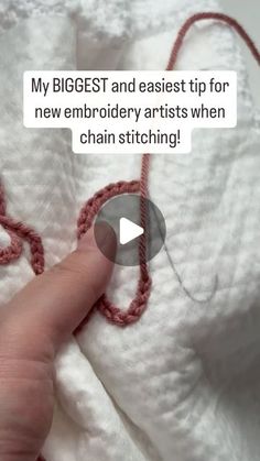 someone is crocheting with their fingers on some white blankets and the caption reads, my biggest and easier tip for new embroidery artists when chain stitching