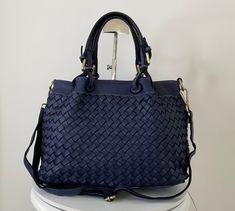 "Navy blue Woven Leather Bag, Soft Woven Handbag, Leather Tote Woman, Handmade Shoulder Bag, Large Tote Bag, Modern Leather Crossbody Bag, Elow comes in two versions, LARGE: W 15\" x H 11.4\" x D 7.1\"  &  SMALL: W 13\" x H 10\" x D 6\". Handle drop: 4\" This bag has made by our italian partner and customizable by our team. We offer one free monogram or name personalization. Please check fonts, color thread, tag samples and leave your monogram or name to embroider. Features: Inside: The bag clos Cheap Blue Woven Shoulder Bag, Navy Leather Bag With Handles, Blue Crossbody Bucket Bag With Top Carry Handle, Navy Shoulder Bag With Detachable Top Handle, Navy Bag With Top Handle, Navy Top Handle Shoulder Bag With Detachable Handle, Navy Top Handle Bag With Detachable Handle, Blue Satchel With Leather Handles For Office, Navy Top Handle Shoulder Bag