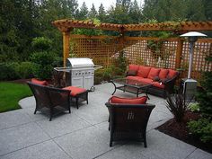 an outdoor living area with patio furniture and fire pit