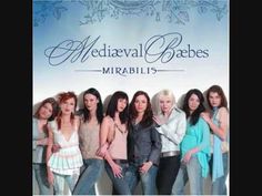 a group of young women standing next to each other in front of a sign that says medieval babes miraabiis