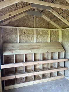 the inside of a building with wooden shelves