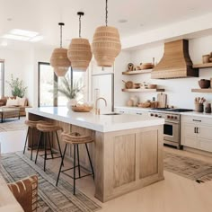 an open kitchen and living room with lots of natural light